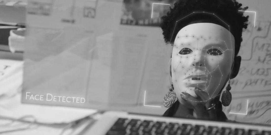 Image of a face being scanned on a computer.