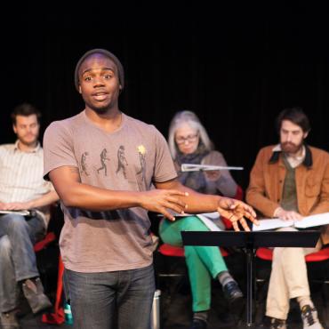 Many Voices Fellow Josh Wilder introducing a scene from his play Leftovers, The Playwrights’ Center. Photo by Heidi Bohnenkamp.