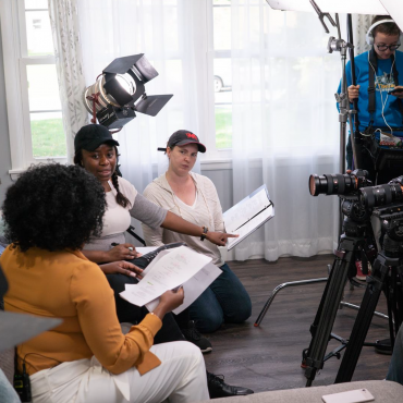 Alison Guessou, directing the cast and crew of the short film Happily Married After.