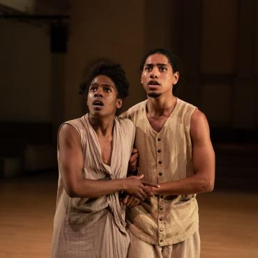 Picture from The New Frontier (My dear America) pt. 1 at Danspace- Kar'mel Small and Kayla Farrish stand together in awe, fear, sadness, loss, shock... Taken from Black Bodies Sonata section