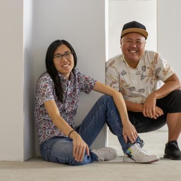 Melissa Li, seated, and Kit Yan, crouching