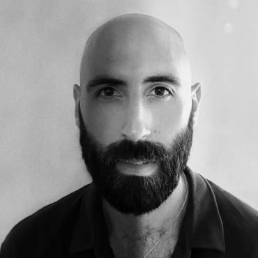 Alex Bijan Zandi, a headshot of a thirty-something Iranian-American filmmaker.