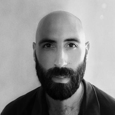 Alex Bijan Zandi, a headshot of a thirty-something Iranian-American filmmaker.